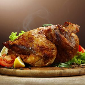 Whole,Roasted,Chicken,With,Vegetables,,On,Wooden,Table,,On,Brown